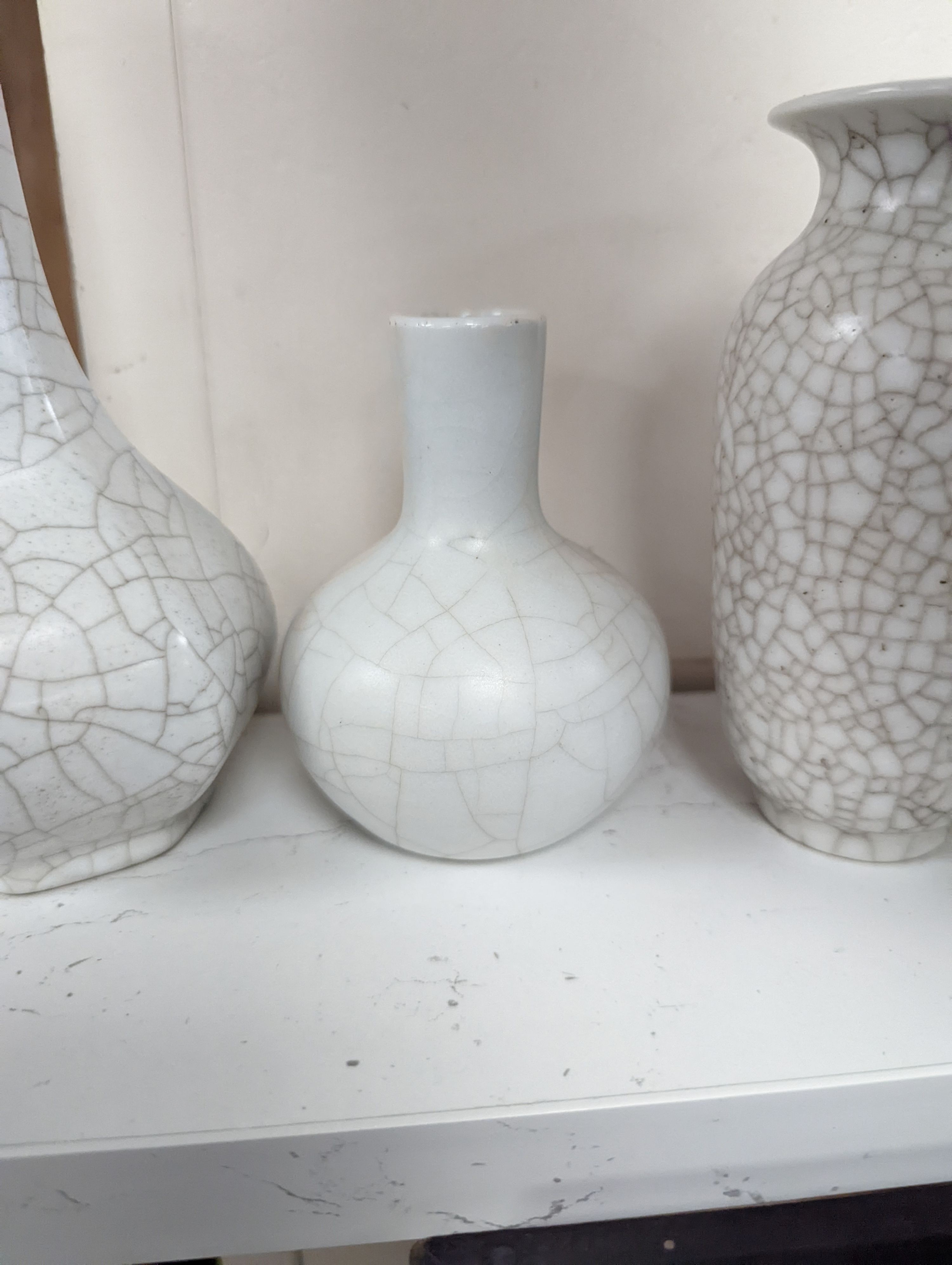 Four Chinese crackle glaze vases, tallest 16 cms high.
